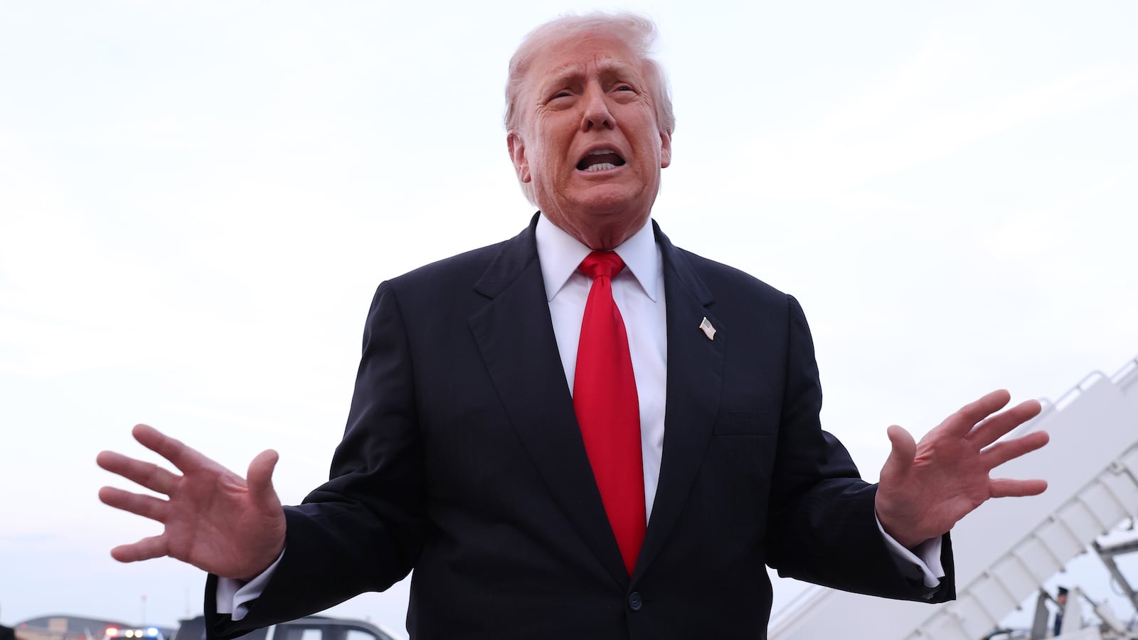 President Donald Trump gives brief remarks to members of the press after exiting Air Force One on November 9, 2025 at Joint Base Andrews, Maryland.