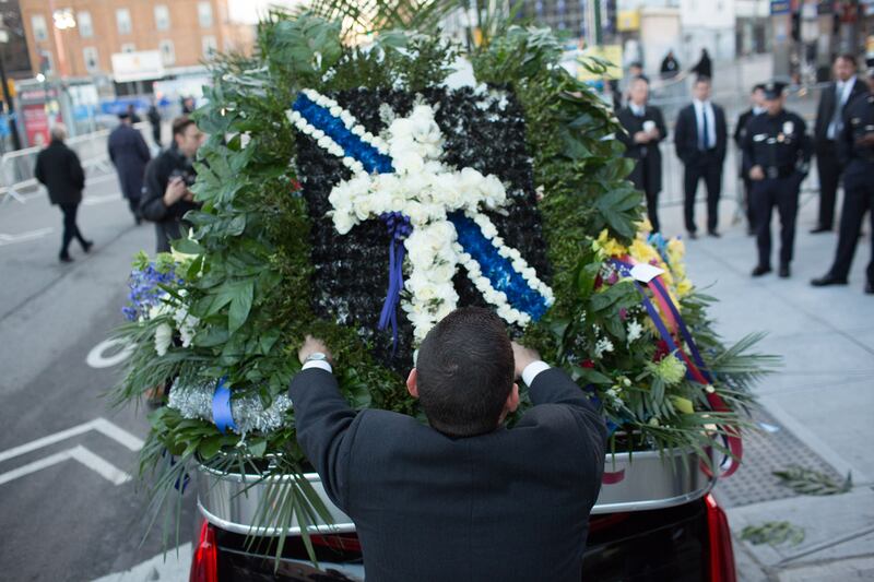 galleries/2014/12/27/the-nypd-says-farewell-to-officer-ramos/141227-police-funeral-05_czrfty