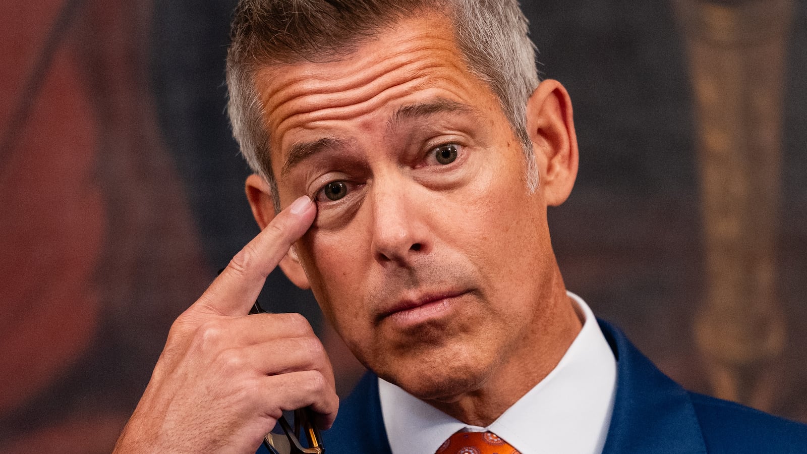 U.S. Secretary of Transportation Sean Duffy gestures during a press conference.