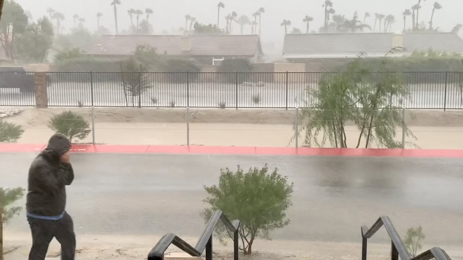 Strong winds and rain are seen from a residence as Tropical Storm Hilary approaches, in Cathedral City, California, U.S. August 20, 2023 in this screen grab obtained from social media video.
