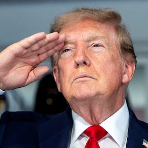U.S. President Donald Trump with first lady Melania Trump during the National Anthem at the start of the Freedom 250 Grand Prix race on the streets of Washington, D.C.,  U.S., August 23, 2026. Doug Mills/Pool via REUTERS