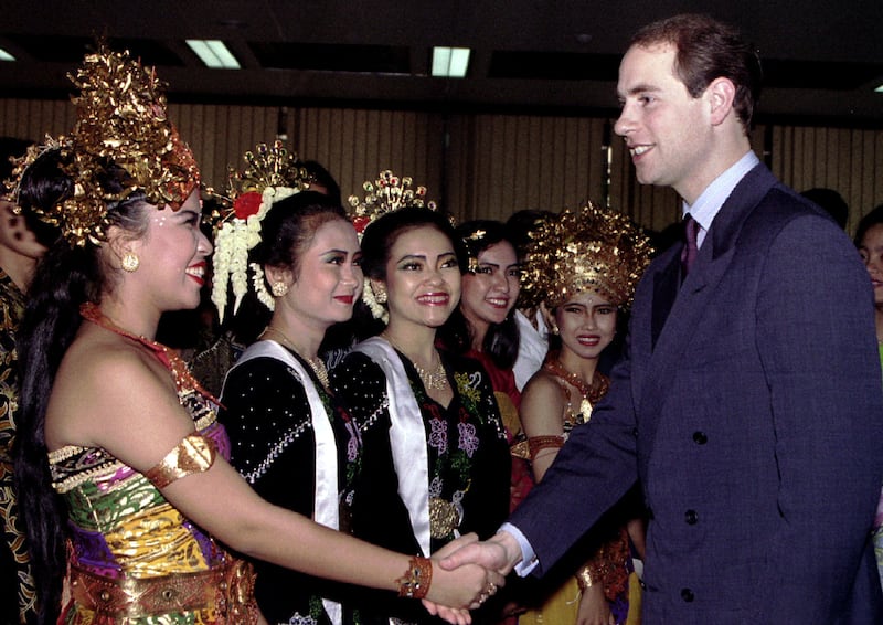 Prince Edward, third in line to the British throne, chats with Indonesian ladies in traditional costumes in Jakarta on March 6 during a visit here as patron of the Duke of Edinburgh's award scheme