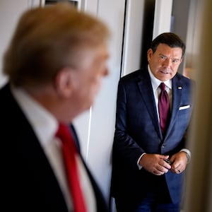 President Donald Trump (L), accompanied by FOX News journalist Bret Baier (R), speaks to members of the media aboard Air Force One on August 15, 2025, in flight. President Trump is traveling to Anchorage, Alaska, for peace talks with Russian President Vladimir Putin on the war with Ukraine.