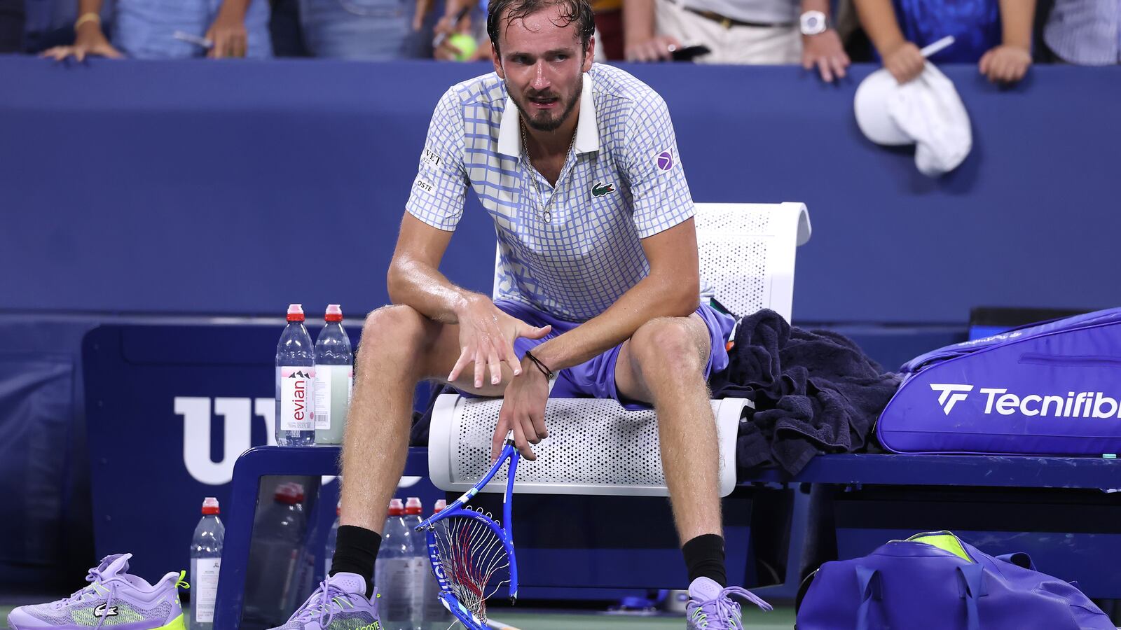 Daniil Medvedev breaks his racket after losing in five sets to Benjamin Bonzi of France