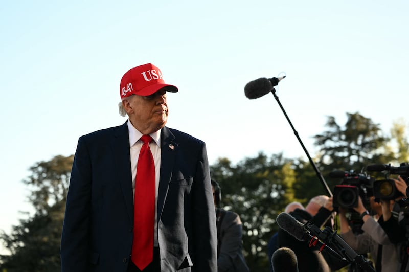 President Donald Trump speaks to the press upon his return to the White House in Washington, DC, on October 6, 2026. President Trump is returning from Sparrows Point, Maryland, where he spoke at Anduril Industries.