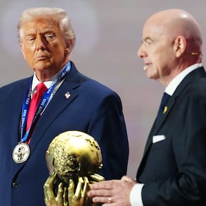 US President Donald Trump delivers his speech after receiving the FIFA Peace Prize from Italian Fifa President Gianni Infantino (R) during the draw for the 2026 FIFA Football World Cup taking place in the US, Canada and Mexico, at the Kennedy Center, in Washington, DC, on December 5, 2025. (Photo by Jia Haocheng / POOL / AFP via Getty Images)
