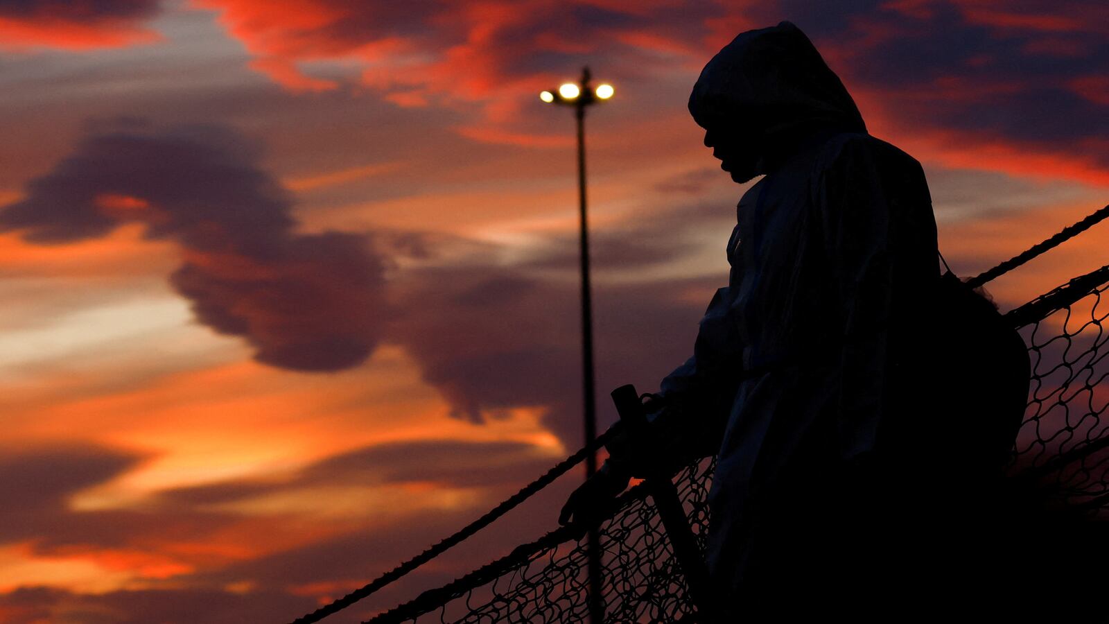 A person disembarks the Geo Barents rescue ship, operated by Doctors Without Borders, in Bari, Italy, March 26, 2023.
