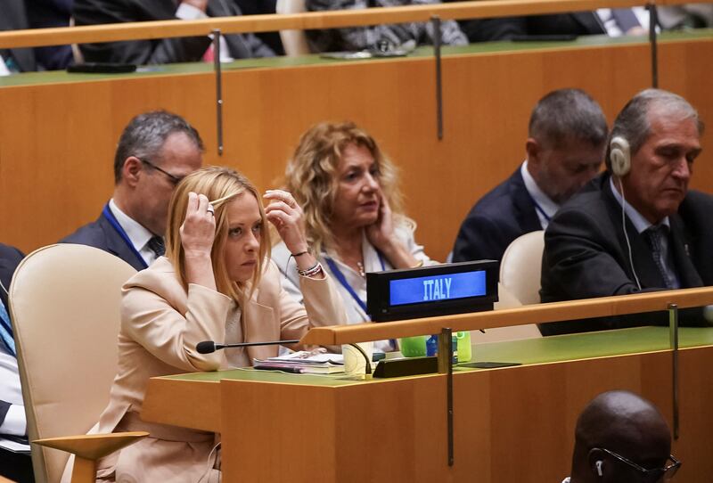 Italy's Prime Minister Giorgia Meloni reacts while listening to U.S. President Donald Trump's (not pictured) speech