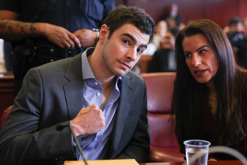 Luigi Mangione (L) appears in Manhattan Supreme Court alongside his attorney Karen Friedman Agnifilo.