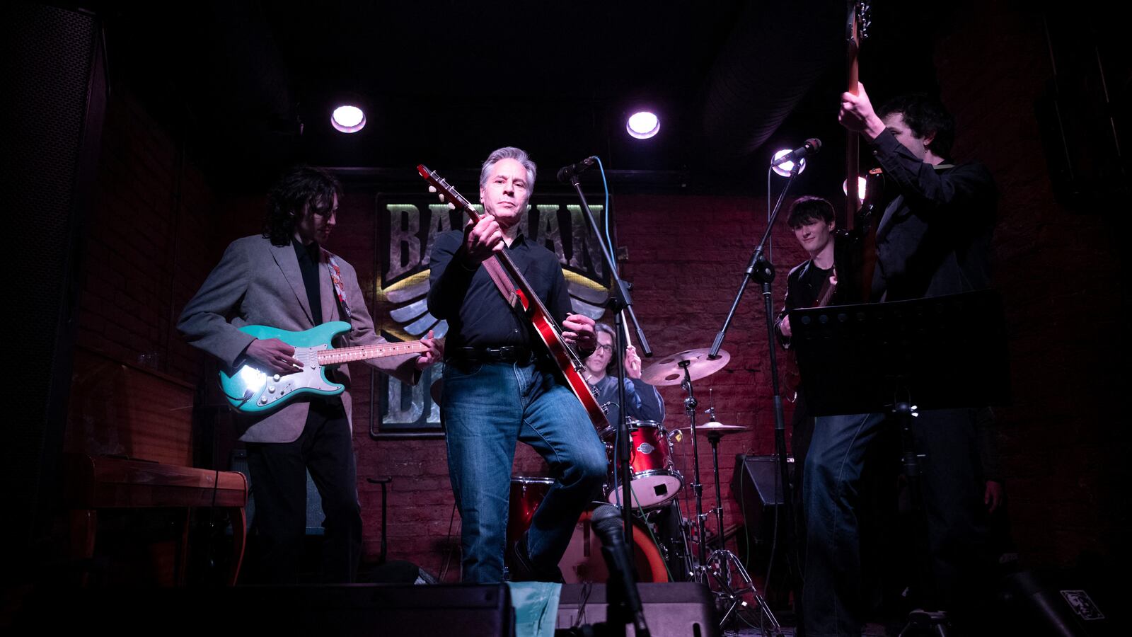 US Secretary of State Antony Blinken performs "Rockin' in the Free World" with members of The 1999 band at the Barman Dictat bar in Kyiv.