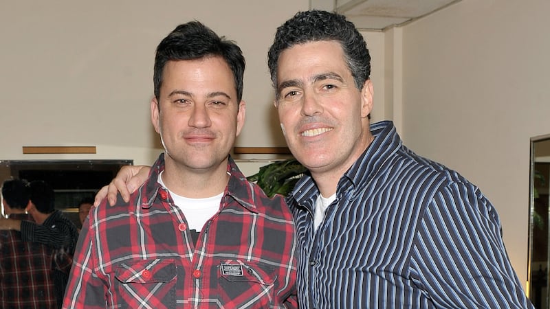 Comedians Jimmy Kimmel helps Adam Carolla celebrate the release of his new paperback book "In Fifty Years We'll All Be Chicks" on May 21, 2011 in Los Angeles, California. (Photo by John M. Heller/WireImage)
