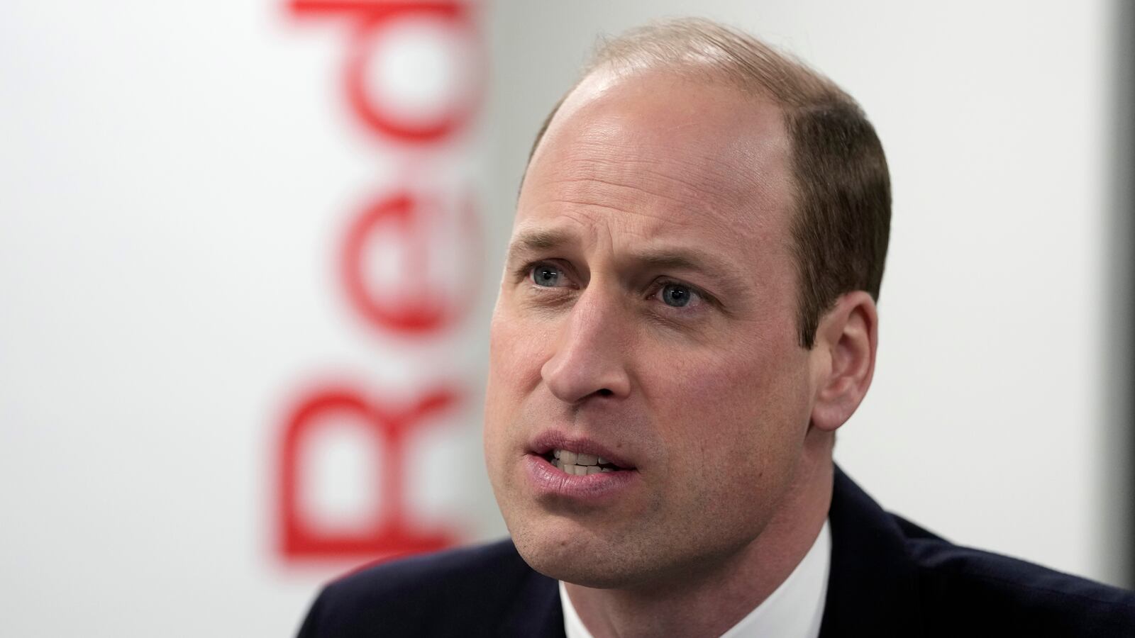 Prince William, The Prince of Wales, listens as he visits the British Red Cross at British Red Cross HQ on February 20