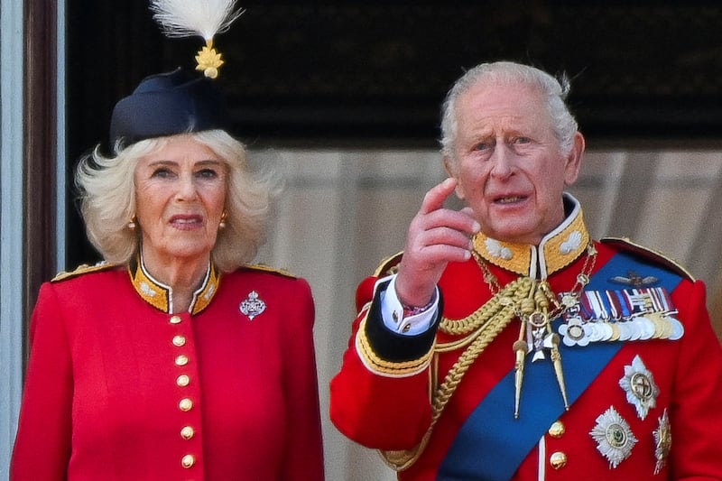 Britain's King Charles and Queen Camilla appear on the balcony of Buckingham Palace during the Trooping the Colour parade to honour Britain's King Charles, as part of the official birthday celebrations, in London, Britain, June 13, 2026. REUTERS/Chris J. Ratcliffe