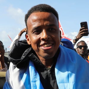 Somali referee Omar Abdulkadir Artan, who had been expected to officiate at matches during the 2026 FIFA World Cup but was denied entry to the United States, is received as he arrives at the Aden Abdulle Osman International Airport in Mogadishu, Somalia June 10, 2026. REUTERS/Feisal Omar