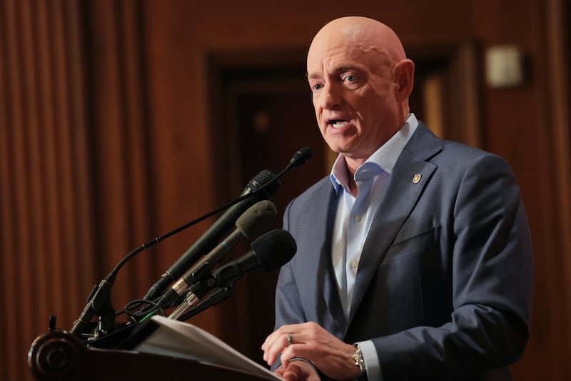 Sen. Mark Kelly speaks at a news conference in the U.S. Capitol on December 1, 2025 to address what he described as intimidating actions by U.S. President Donald Trump and Secretary Pete Hegseth after he participated in a video over "illegal orders."