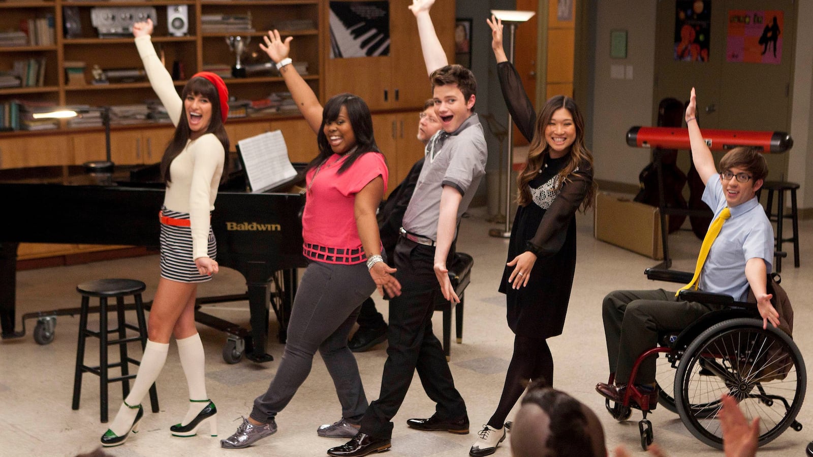 Characters from the TV show "Glee" sing and dance.