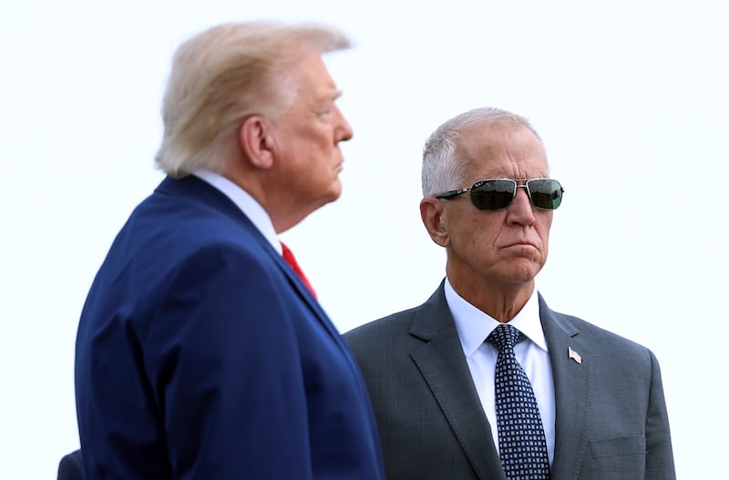 DOVER, DELAWARE - JULY 22: U.S. Sen. Thom Tillis (R-NC) stands alongside U.S. President Donald Trump during a dignified transfer at Dover Air Force Base for military casualties of the war with Iran on July 22, 2026 in Dover, Delaware. President Trump attend the dignified transfer of Army 1st Lt. Tyler James Feehan, Staff Sgt. Michael Emmanuel Swinton, Army Sgt. Angel S. Rampersad and Army Pvt. Isabella Gonzales. (Photo by Kevin Dietsch/Getty Images)