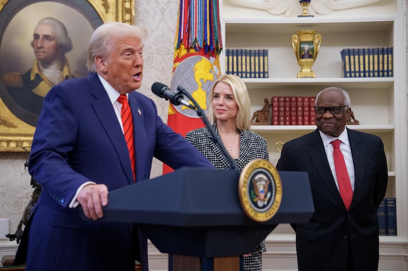 WASHINGTON, DC - FEBRUARY 5: U.S. President Donald Trump, accompanied by Pam Bondi (C), and U.S. Supreme Court Associate Justice Clarence Thomas (R), speaks before Bondi is sworn in as U.S. Attorney General in the Oval Office at the White House on February 05, 2025 in Washington, DC. The Senate confirmed Bondi as Attorney General with a 54-46 vote on Tuesday. (Photo by Andrew Harnik/Getty Images)