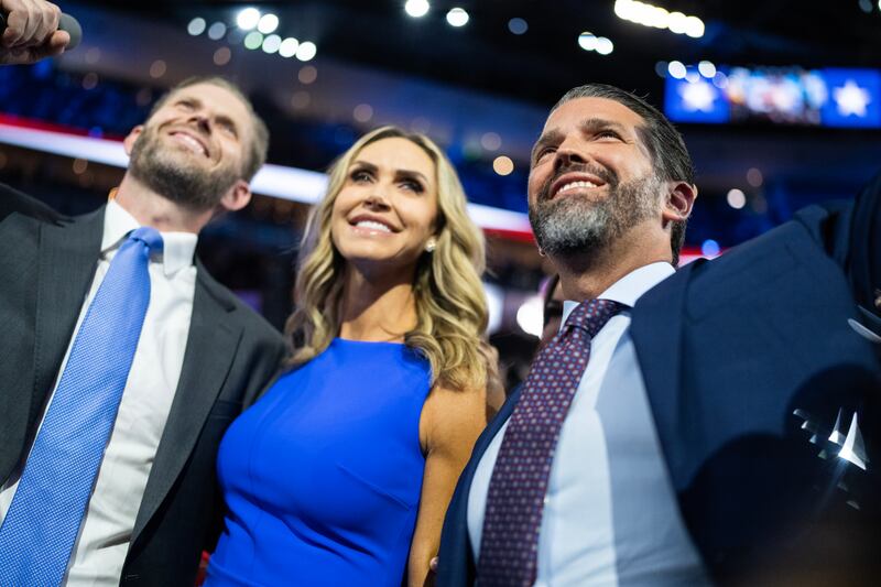 WASHINGTON - JULY 15: The family of Donald J. Trump from left, Eric Trump, his wife Lara Trump, co-chair of the Republican National Committee, and Donald Trump Jr., cast votes to nominate him as the Republican presidential nominee in Fiserv Forum on the first day of Republican National Convention in Milwaukee, Wis., on Monday, July 15, 2024. (Tom Williams/CQ-Roll Call, Inc via Getty Images)