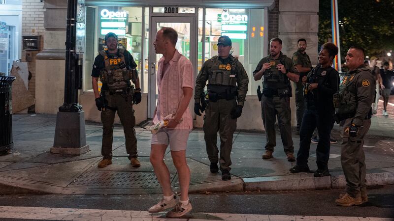 FBI and Border Patrol officers speak with Sean Charles Dunn, after he allegedly assaulted law enforcement with a sandwich.