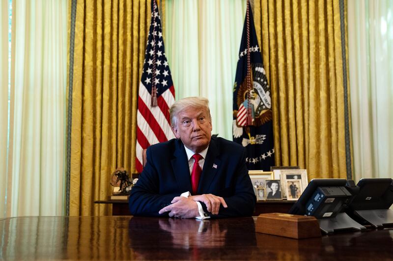 WASHINGTON, DC - AUGUST 28: U.S. President Donald Trump listens during an event in the Oval Office of the White House August 28, 2020 in Washington, DC. President Trump has officially pardoned former federal prisoner Alice Johnson, who was sentenced to life for cocaine trafficking in 1997 and recently received a commutation from the President in 2018. (Photo by Anna Moneymaker/Pool/Getty Images)