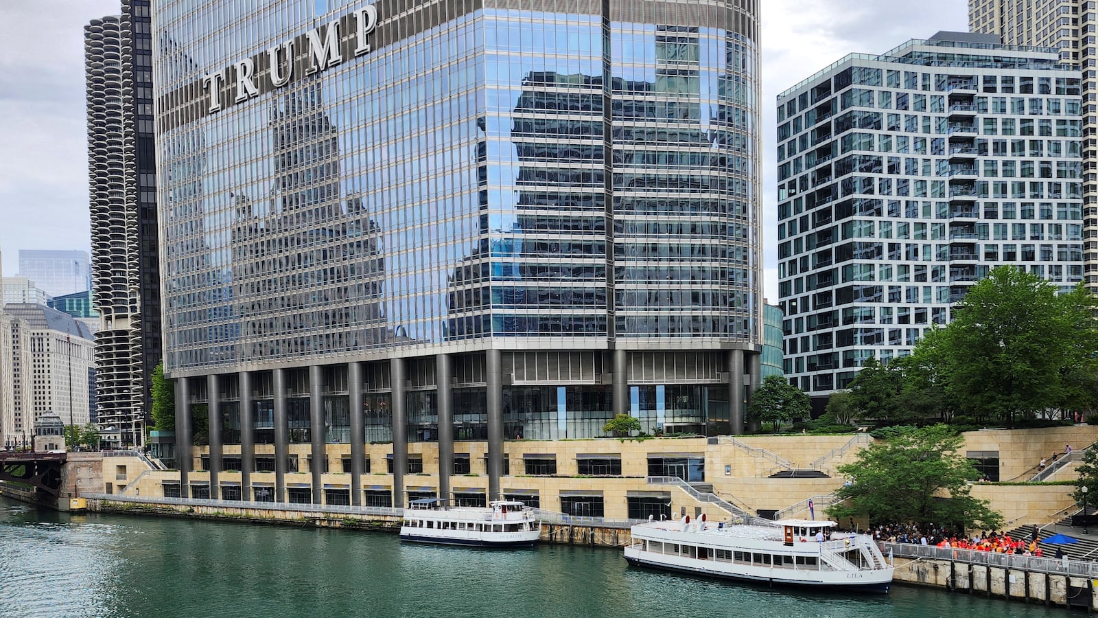 Kayakers on the Chicago River paddle toward Trump Tower in Chicago, Illinois, on Aug. 1, 2024.