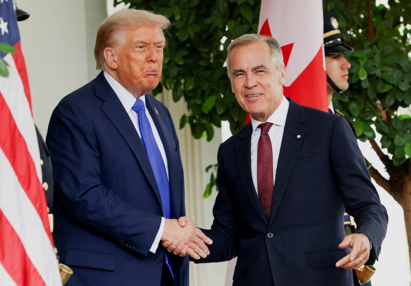 U.S. President Donald Trump welcomes Canada's Prime Minister Mark Carney at the White House in Washington, D.C., U.S., October 7, 2025.