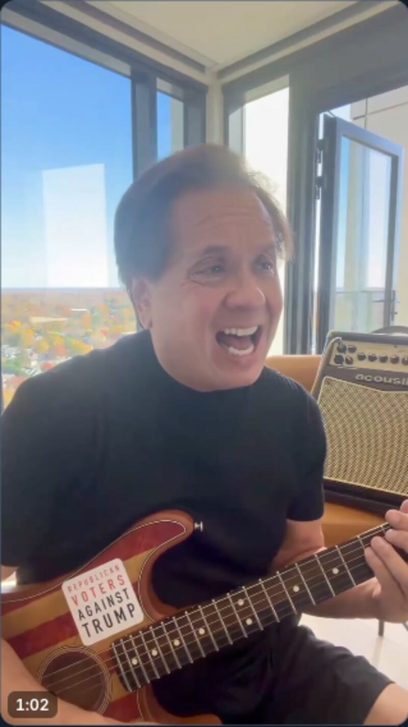 George Conway sings with guitar.