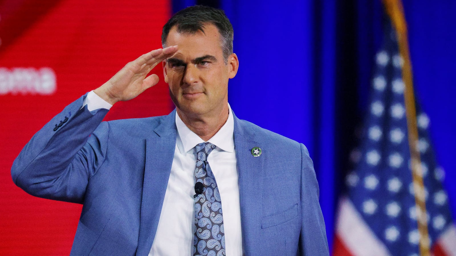 Oklahoma Governor Kevin Stitt gestures onstage at the Conservative Political Action Conference (CPAC) in Dallas, Texas, U.S., August 5, 2022.