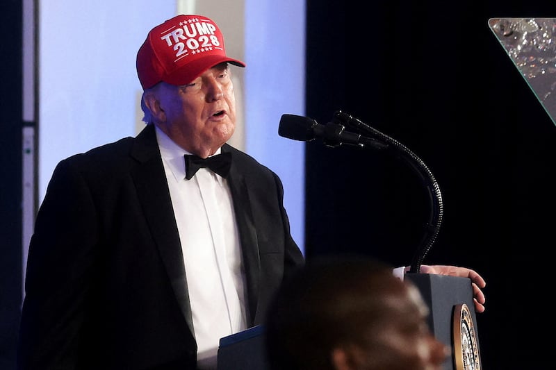 U.S. President Donald Trump wears a "Trump 2028" hat as he delivers remarks at the White House Correspondents' Association (WHCA) Dinner, which was rescheduled from April after it was interrupted when a man tried to force his way through security and fired a shotgun, at the Waldorf Astoria hotel in Washington, D.C., U.S., July 24, 2026.