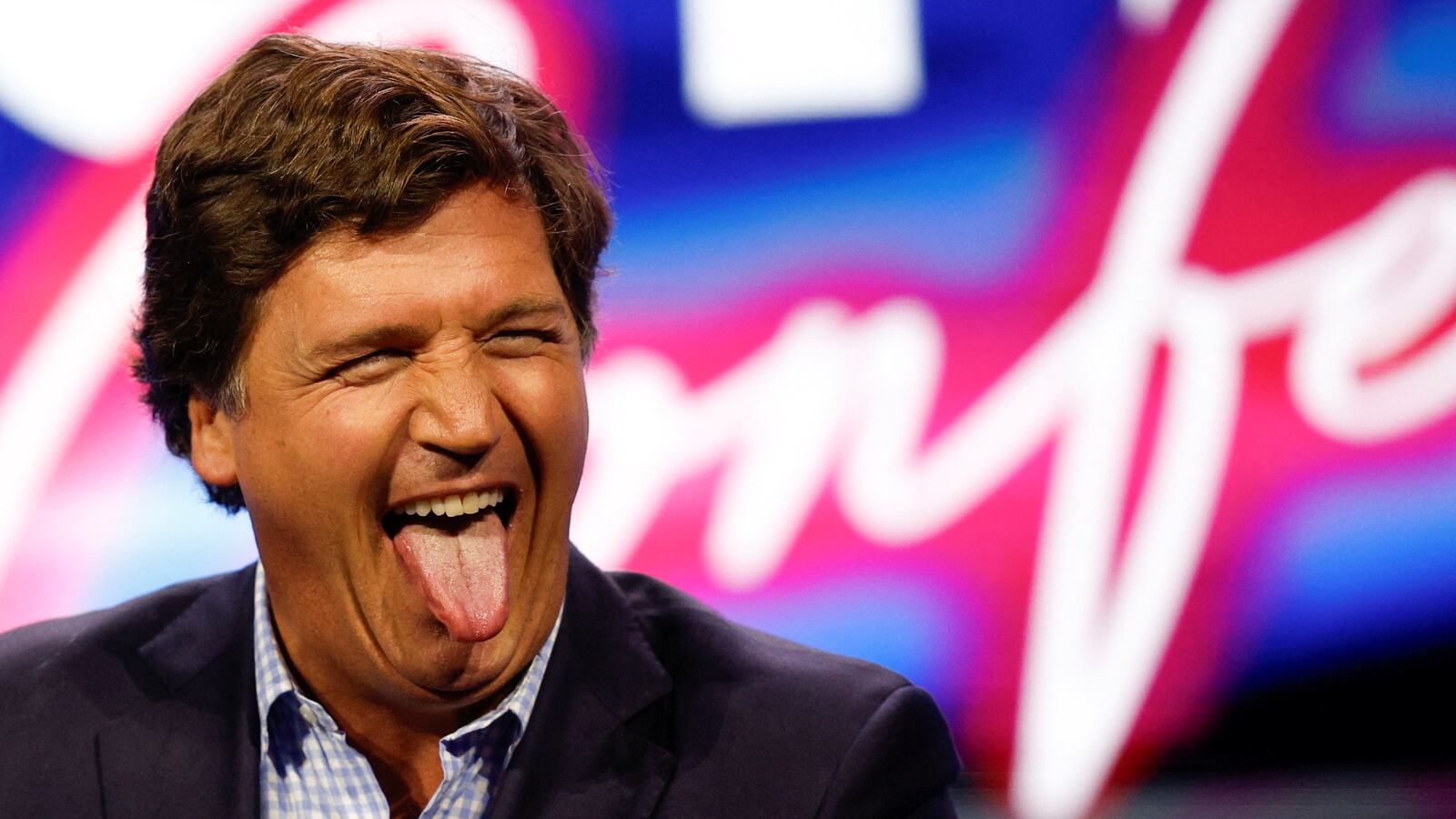 Former Fox News commentator Tucker Carlson reacts as he speaks during the Turning Point Action Conference in West Palm Beach, Florida, July 15, 2023.