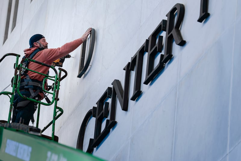 Workers begin adjusting the name of the “John F. Kennedy Memorial Center for the Performing Arts" on December 19, 2025 in Washington, DC after the Trump appointed board voted to add his name despite the law strictly prohibiting the change.