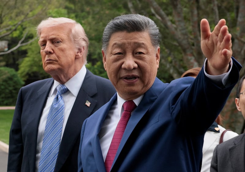 Chinese President Xi Jinping gestures as he greets U.S. President Donald Trump at Zhongnanhai Garden in Beijing, China, May 15, 2026.