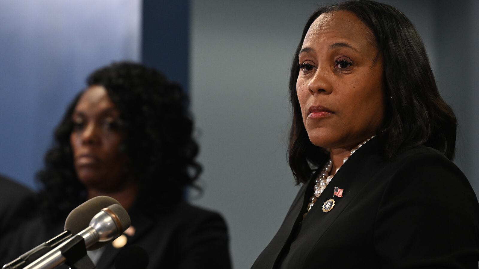 Fulton County District Attorney Fani Willis speaks during a news conference.