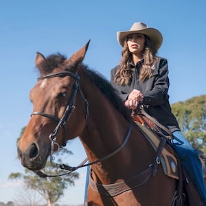 Homeland Security Kristi Noem rides a horse alongside Argentina's Security Minister Patricia Bullrich.