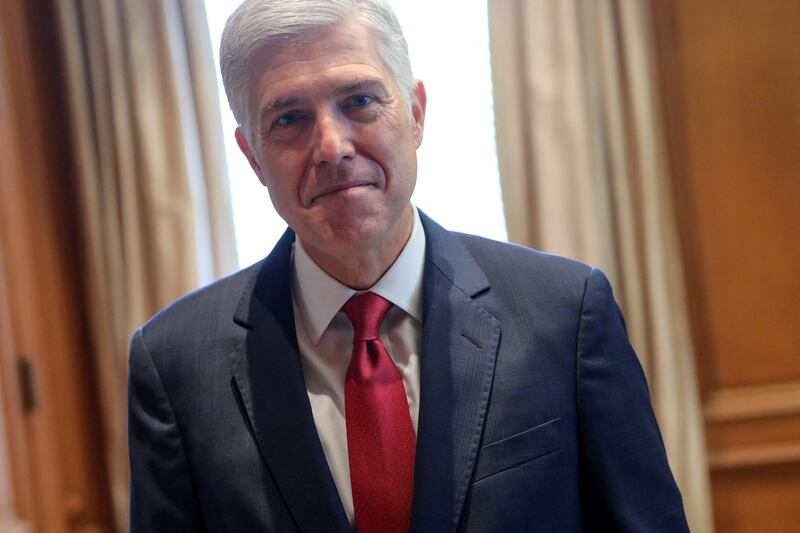 U.S. Supreme Court Justice Neil Gorsuch poses for a picture in his chambers at the Supreme Court building in Washington, U.S. September 13, 2019.