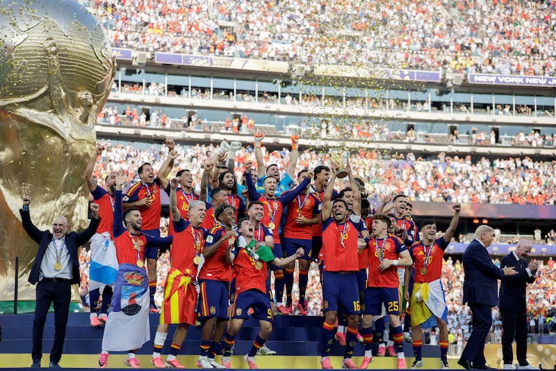 U.S. President Donald Trump and FIFA President Gianni Infantino applaud after presenting the FIFA World Cup trophy to Spain after its victory in the 2026 World Cup final at New York New Jersey Stadium in East Rutherford, New Jersey, U.S., July 19, 2026.