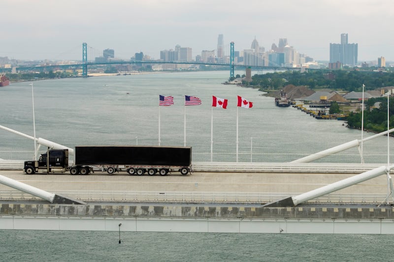 FILE PHOTO: A drone view shows a vehicle crossing the $4.7 billion Gordie Howe International Bridge, connecting Windsor, Ontario and Detroit, Michigan, the day after it opened in Windsor, Ontario, Canada, July 28, 2026.  REUTERS/Carlos Osorio/File Photo
