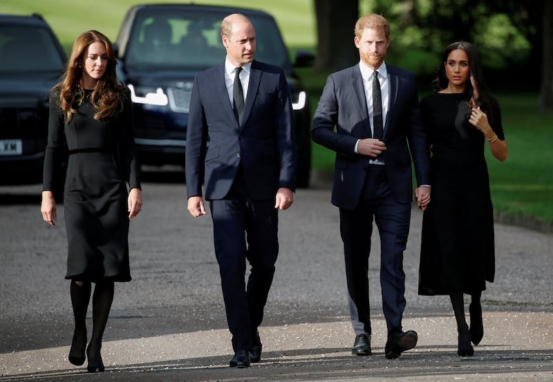 Britain's William, Prince of Wales, Catherine, Princess of Wales, Prince Harry and Meghan, the Duchess of Sussex walk outside Windsor Castle, following the passing of Britain's Queen Elizabeth, in Windsor, Britain, September 10, 2022