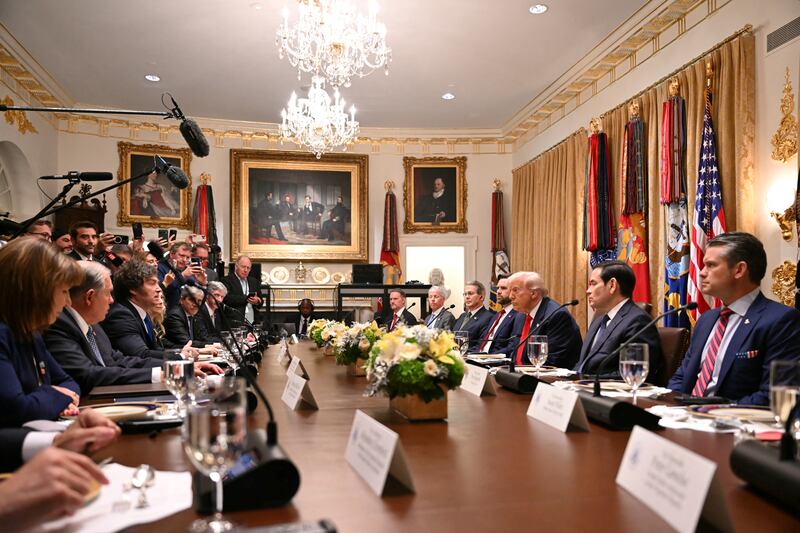 US President Donald Trump (3rd R) meets with Argentina's President Javier Milei (3rd L) in the Cabinet Room at the White House in Washington, DC, on October 14, 2025. (Photo by ANDREW CABALLERO-REYNOLDS / AFP) (Photo by ANDREW CABALLERO-REYNOLDS/AFP via Getty Images)