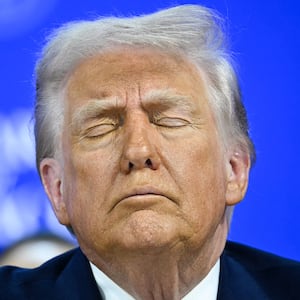 President Donald Trump reacts at the "Board of Peace" meeting during the World Economic Forum (WEF) annual meeting in Davos on January 22, 2026.