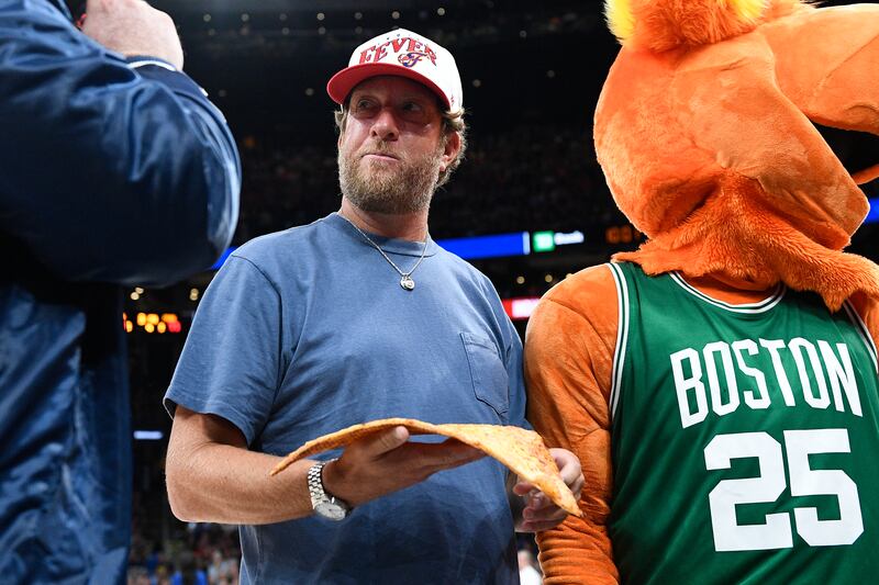 BOSTON, MA - JULY 15: Dave Portnoy holds a slice of pizza during a one bite pizza review during a WNBA game between the Indiana Fever and the Connecticut Sun on July 15, 2025, at TD Garden in Boston, MA. (Photo by Erica Denhoff/Icon Sportswire via Getty Images)