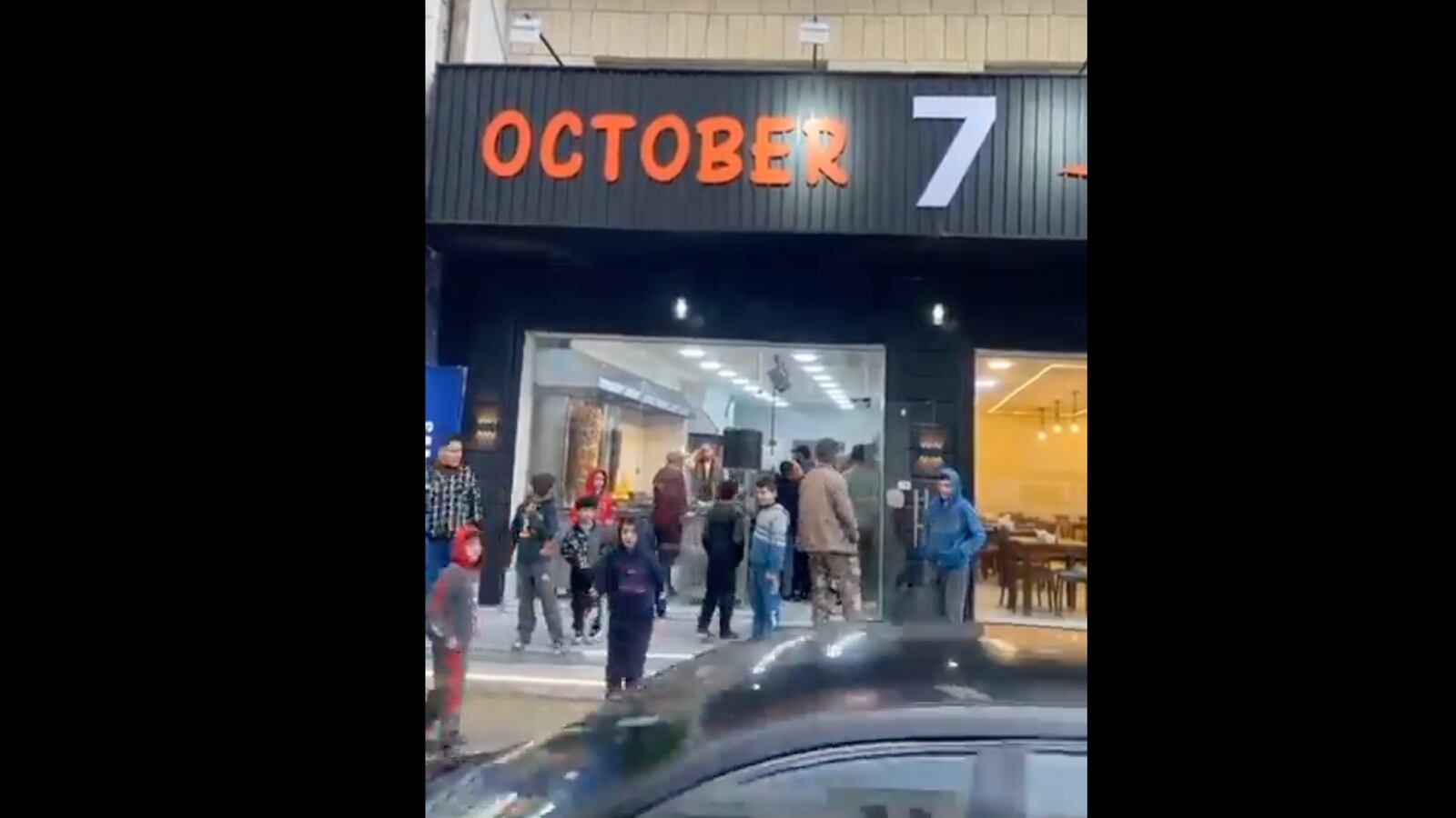 A screenshot of footage showing a new restaurant called "October 7" in Jordan.