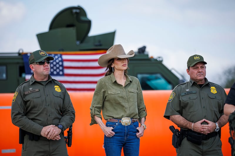 Secretary of Homeland Security Kristi Noem stands alongside U.S. Border Patrol Rio Grande Valley Sector Chief Jared Ashby, left, and U.S. Border Patrol Chief Mike Banks at a news conference on January 7, 2026 in Brownsville, Texas.