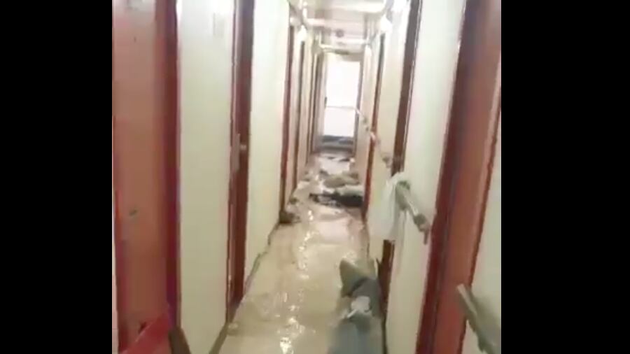 A flooded hallway on a Carnival cruise ship.