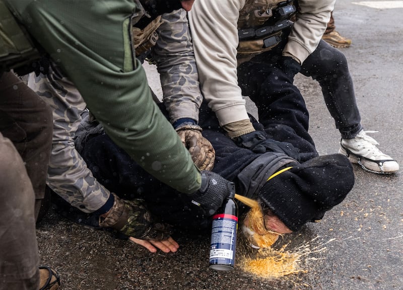 A protester was pinned to the ground by federal agents and a chemical irritant was sprayed directly into his face, Wednesday, January 21, 2026, in south Minneapolis, Minn.