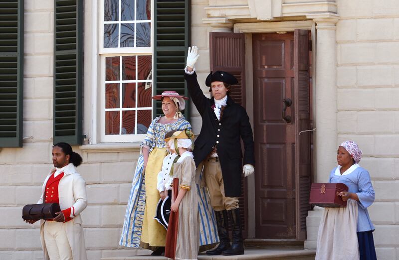 Reenactors in period costumes reenact the 1759 arrival of Colonel George Washington and his bride, Martha, and her two young children, to Washington's estate at Mount Vernon, the plantation owned by Washington in Fairfax County, Virginia, near Alexandria.