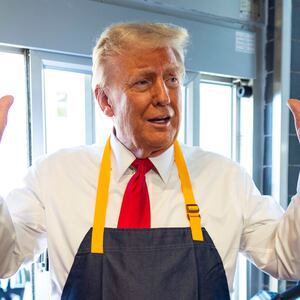 Republican presidential nominee, former U.S. President Donald Trump works behind the counter during a campaign event at McDonald's restaurant on October 20, 2024 in Feasterville-Trevose, Pennsylvania.