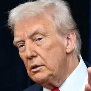 TOPSHOT - US President Donald Trump (L) and China's President Xi Jinping arrive for talks at the Gimhae Air Base, located next to the Gimhae International Airport in Busan on October 30, 2025. Donald Trump and Chinese leader Xi Jinping will seek a truce in their bruising trade war on October 30, with the US president predicting a "great meeting" but Beijing being more circumspect. (Photo by ANDREW CABALLERO-REYNOLDS / AFP) (Photo by ANDREW CABALLERO-REYNOLDS/AFP via Getty Images)