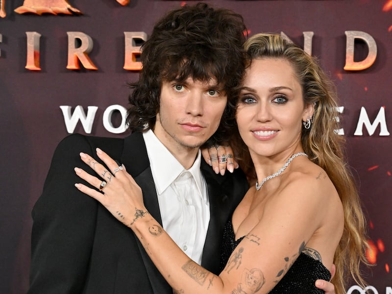 HOLLYWOOD, CALIFORNIA - DECEMBER 01: Maxx Morando and Miley Cyrus attend the Global Premiere of 20th Century Studios' "Avatar: Fire and Ash" at Dolby Theatre on December 01, 2025 in Hollywood, California. (Photo by Axelle/Bauer-Griffin/FilmMagic)